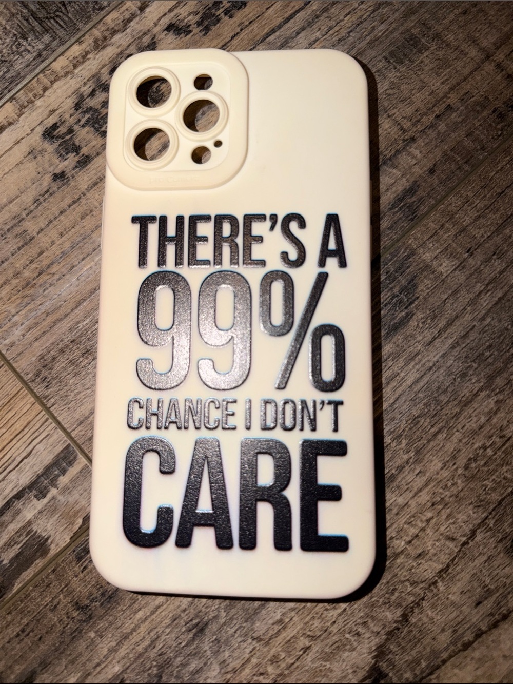 Cream Phone Case with Black Text "There's a 99% Chance I Don't Care"